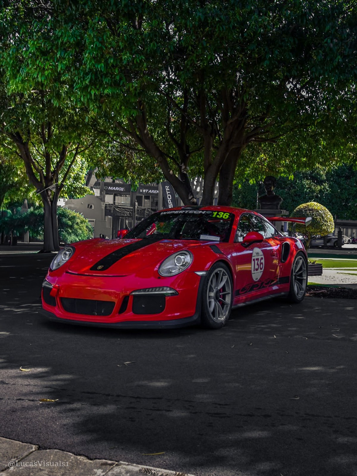 Red Porsche 911 GT3 RS on a suburban street